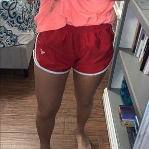 red varsity running shorts